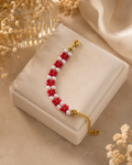 Handmade Red & Pearl Beaded Bracelet | Adjustable Floral Bracelet for Womenmade red and pearl floral beaded bracelet with an adjustable gold-tone chain. Lightweight, stylish, and perfect for daily wear, parties, festive occasions, and gifting.